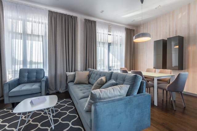 living room with two blue couches